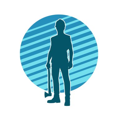 Hareket halindeki bir işçinin silueti, baltasını kullanarak poz verir..