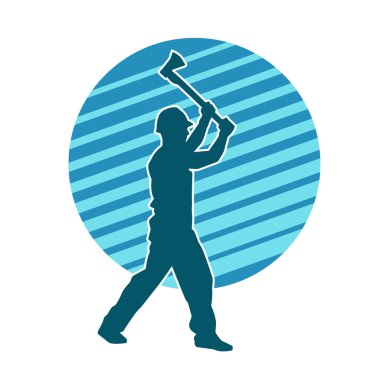 Hareket halindeki bir işçinin silueti, baltasını kullanarak poz verir..