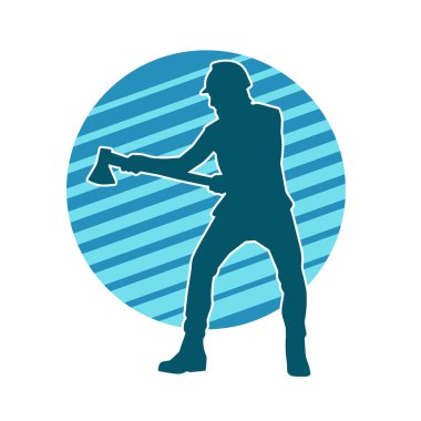 Hareket halindeki bir işçinin silueti, baltasını kullanarak poz verir..