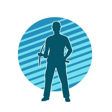 Görev sırasında baltayla dolaşan işçi kostümlü bir adamın silüeti. Bir madencinin hareket halindeki silueti balta aracı ile poz verir.