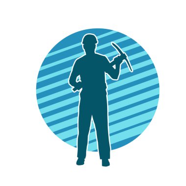 Görev sırasında baltayla dolaşan işçi kostümlü bir adamın silüeti. Bir madencinin hareket halindeki silueti balta aracı ile poz verir.