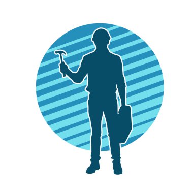 Çekiç aleti taşıyan bir işçinin silüeti. Hareket halindeki bir işçinin silueti çekiç aleti ile poz verir.