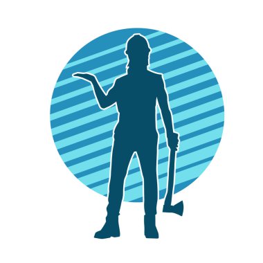 Hareket halindeki bir işçinin silueti, baltasını kullanarak poz verir..