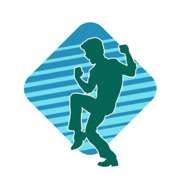 Hareket halindeki bir erkek dansçının silueti. Dans eden zayıf bir adamın silueti..