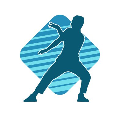 Hareket halindeki bir erkek dansçının silueti. Dans eden zayıf bir adamın silueti..