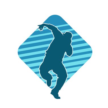 Hareket halindeki bir erkek dansçının silueti. Dans eden zayıf bir adamın silueti..