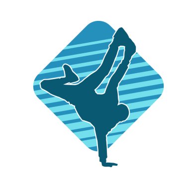 Poz veren bir erkek dansçının silueti. Dans eden bir adamın silueti.