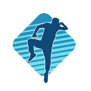 Hareket halindeki bir erkek dansçının silueti. Dans eden zayıf bir adamın silueti..