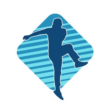 Hareket halindeki bir erkek dansçının silueti. Dans eden zayıf bir adamın silueti..