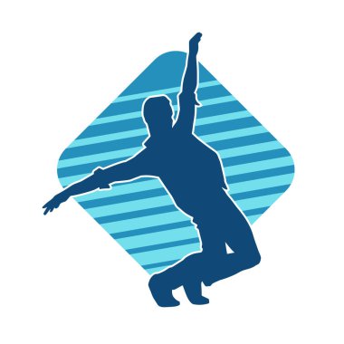 Hareket halindeki bir erkek dansçının silueti. Dans eden zayıf bir adamın silueti..