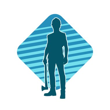 Hareket halindeki bir işçinin silueti, baltasını kullanarak poz verir..