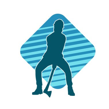 Hareket halindeki bir işçinin silueti, baltasını kullanarak poz verir..