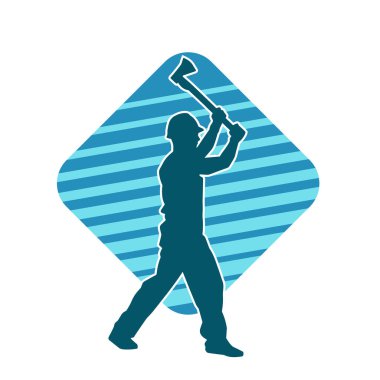 Hareket halindeki bir işçinin silueti, baltasını kullanarak poz verir..