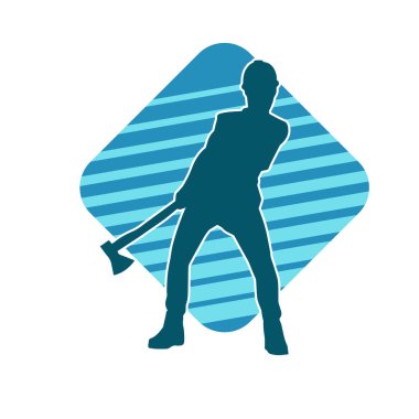 Hareket halindeki bir işçinin silueti, baltasını kullanarak poz verir..