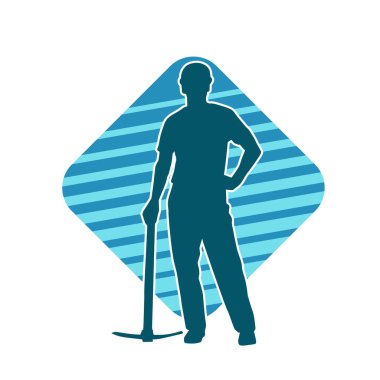 Görev sırasında baltayla dolaşan işçi kostümlü bir adamın silüeti. Bir madencinin hareket halindeki silueti balta aracı ile poz verir.