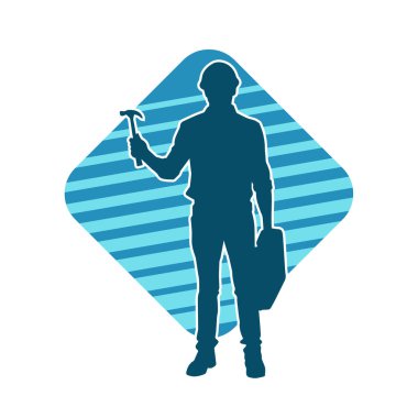 Çekiç aleti taşıyan bir işçinin silüeti. Hareket halindeki bir işçinin silueti çekiç aleti ile poz verir.