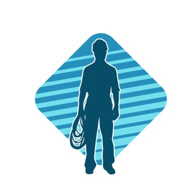 İnşaat işçisi kostümlü bir adamın silueti. İnşaat işçisinin silueti pozda.. 