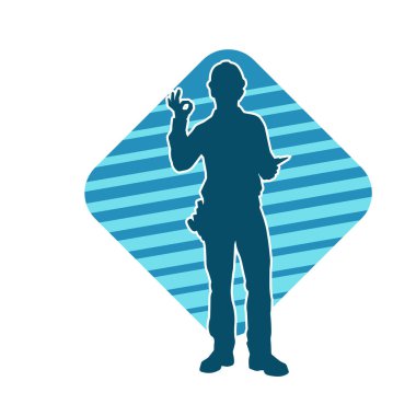 İnşaat işçisi kostümlü bir adamın silueti. İnşaat işçisinin silueti pozda.. 