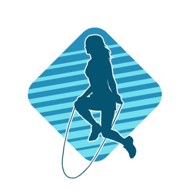 Zayıf, sportif bir kadının silüeti ip atlama egzersizi yapıyor..