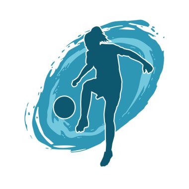 Topa vuran bayan futbolcunun silueti. Hareketli bir futbolcu kadının silueti..