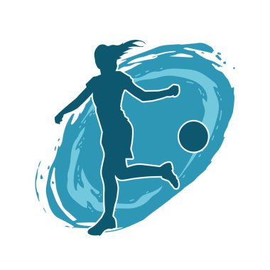 Topa vuran bayan futbolcunun silueti. Hareketli bir futbolcu kadının silueti..