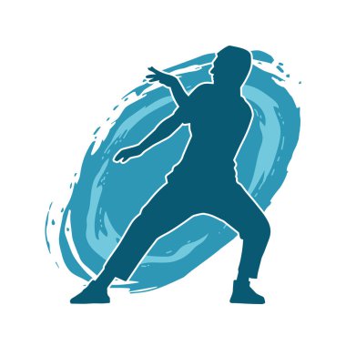 Hareket halindeki bir erkek dansçının silueti. Dans eden zayıf bir adamın silueti..