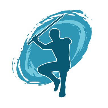 Bir erkek savaşçının silueti kılıçla poz veriyor. Kılıç taşıyan bir savaşçının silueti..