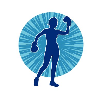 Kadın boks oyuncusunun silueti. Boks yaparken boks eldiveni giyen bir kadının silueti..