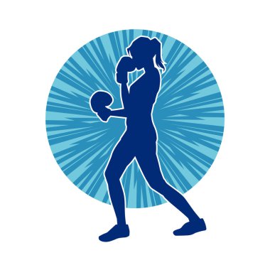 Kadın boks oyuncusunun silueti. Boks yaparken boks eldiveni giyen bir kadının silueti..