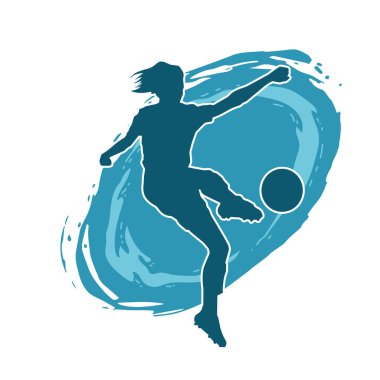 Topa vuran bayan futbolcunun silueti. Hareketli bir futbolcu kadının silueti..