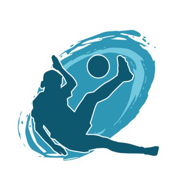 Topa vuran bayan futbolcunun silueti. Hareketli bir futbolcu kadının silueti..