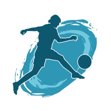 Topa vuran bayan futbolcunun silueti. Hareketli bir futbolcu kadının silueti..
