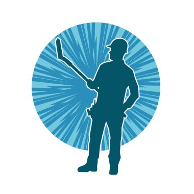 Kürek taşıyan bir işçinin silüeti. Bir işçinin hareket halindeki silueti kürek aracı kullanarak poz verir.