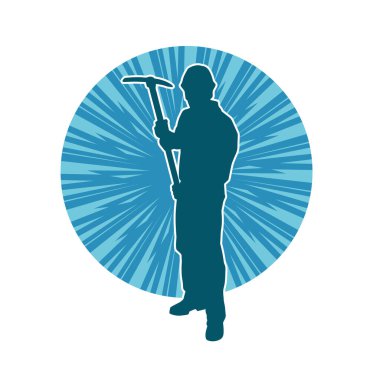 Görev sırasında baltayla dolaşan işçi kostümlü bir adamın silüeti. Bir madencinin hareket halindeki silueti balta aracı ile poz verir.