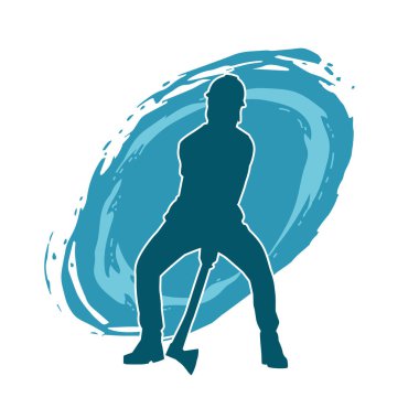 Hareket halindeki bir işçinin silueti, baltasını kullanarak poz verir..