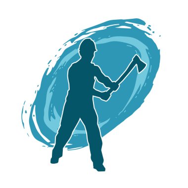 Hareket halindeki bir işçinin silueti, baltasını kullanarak poz verir..