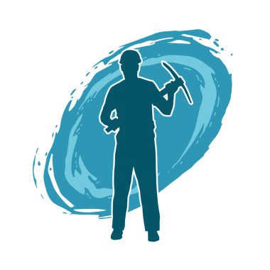 Görev sırasında baltayla dolaşan işçi kostümlü bir adamın silüeti. Bir madencinin hareket halindeki silueti balta aracı ile poz verir.