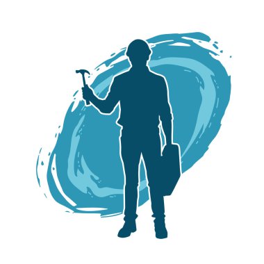 Çekiç aleti taşıyan bir işçinin silüeti. Hareket halindeki bir işçinin silueti çekiç aleti ile poz verir.