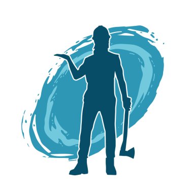 Hareket halindeki bir işçinin silueti, baltasını kullanarak poz verir..