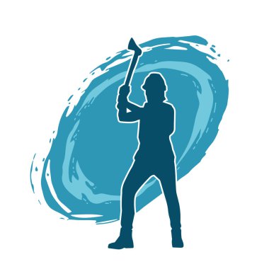 Hareket halindeki bir işçinin silueti, baltasını kullanarak poz verir..