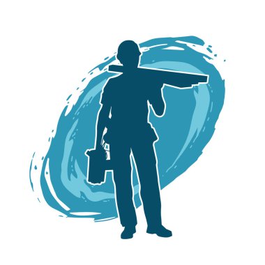 Tahta taşıyan bir inşaat işçisinin silueti..