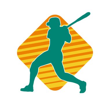 Hareketli bir erkek beyzbol oyuncusunun silueti. Vurucu olarak beyzbol oynayan bir adamın silueti..