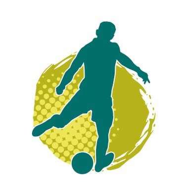 Top tekmeleyen bir erkek futbolcunun silueti. Hareket halindeki bir futbolcunun silueti.