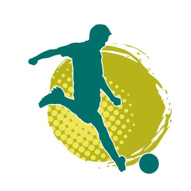 Top tekmeleyen bir erkek futbolcunun silueti. Hareket halindeki bir futbolcunun silueti.