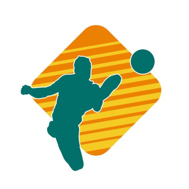 Top tekmeleyen bir erkek futbolcunun silueti. Hareket halindeki bir futbolcunun silueti.