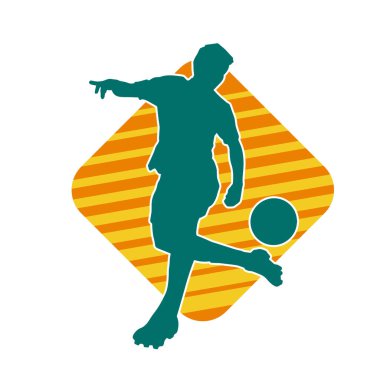 Top tekmeleyen bir erkek futbolcunun silueti. Hareket halindeki bir futbolcunun silueti.