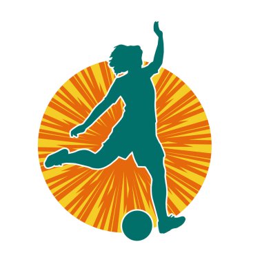 Topa vuran bayan futbolcunun silueti. Hareketli bir futbolcu kadının silueti..