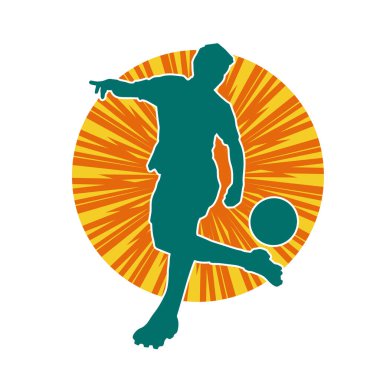 Top tekmeleyen bir erkek futbolcunun silueti. Hareket halindeki bir futbolcunun silueti.