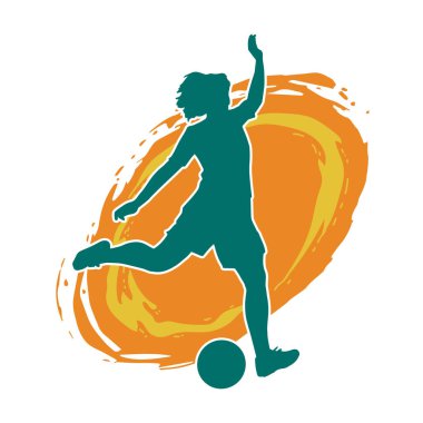 Topa vuran bayan futbolcunun silueti. Hareketli bir futbolcu kadının silueti..
