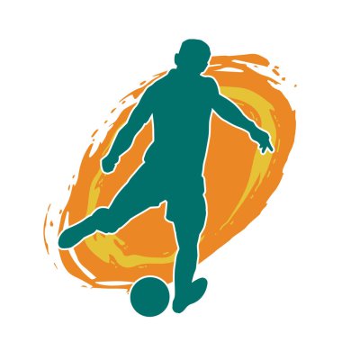 Top tekmeleyen bir erkek futbolcunun silueti. Hareket halindeki bir futbolcunun silueti.